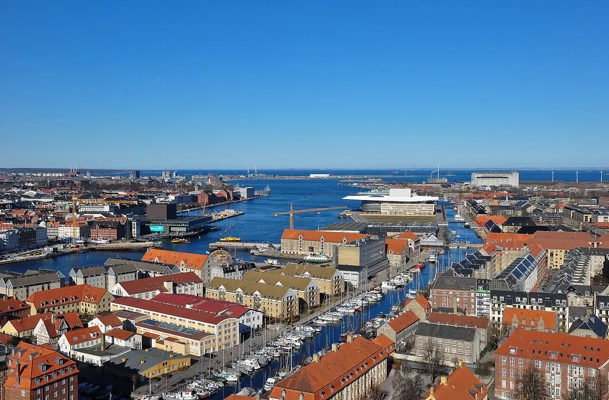 Panoramic view of Copenhagen Harbor and city buildings from above.