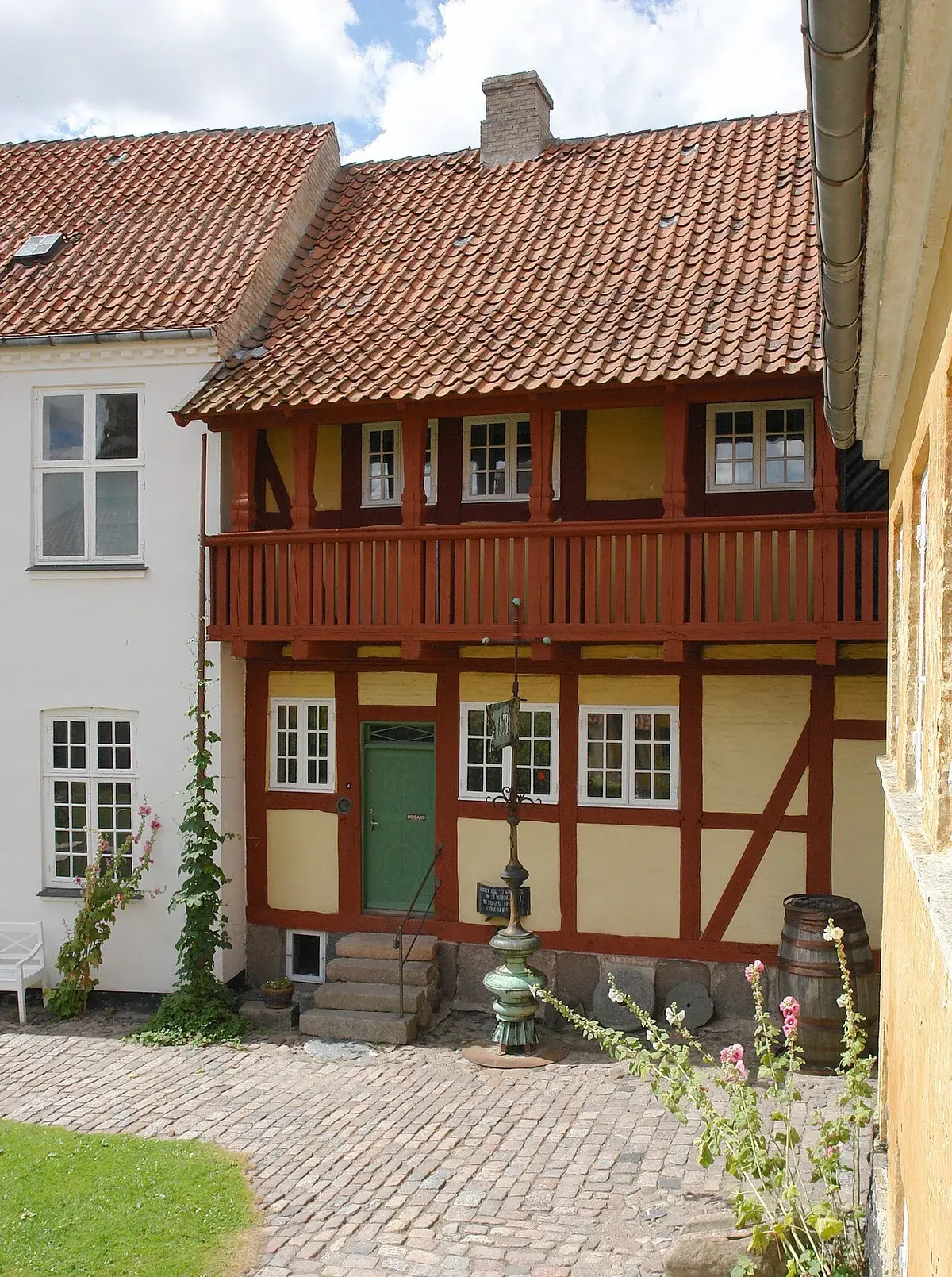 Half-timbered historic house with a balcony at Holbæk Museum.