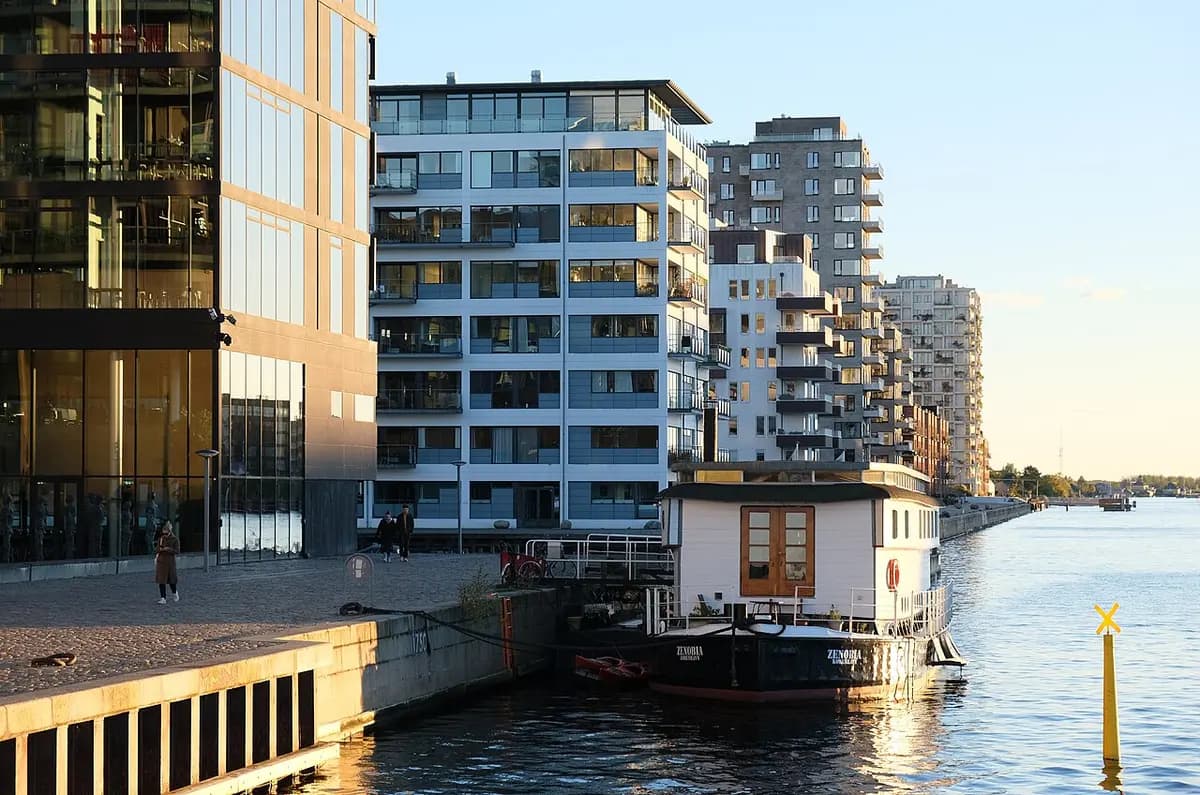 Copenhagen harbor waterfront and buildings at Islands Brygge