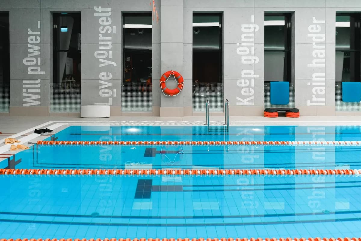 indoor swimming pool with motivational quotes on walls