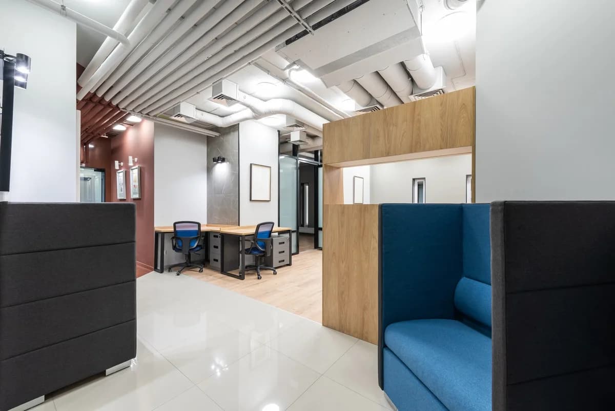 Bright modern office interior with desks and lounge seating
