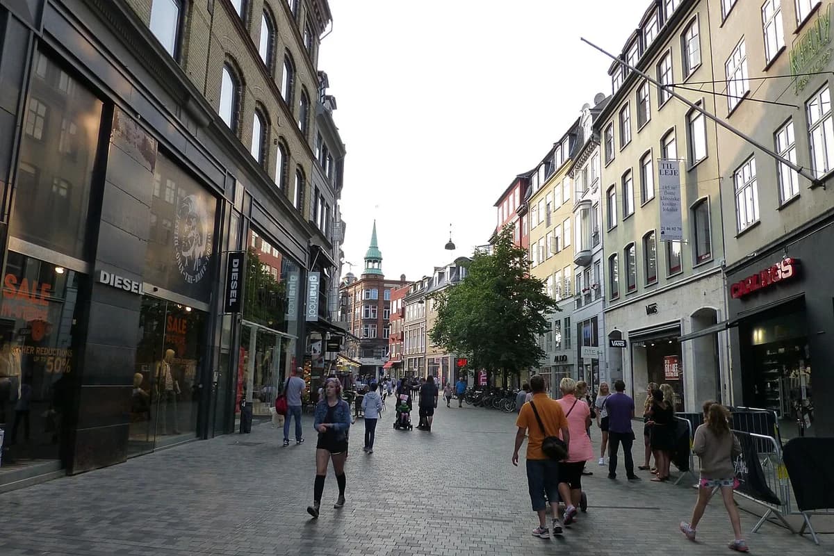 People walking along Strøget, a shopping street in Copenhagen.