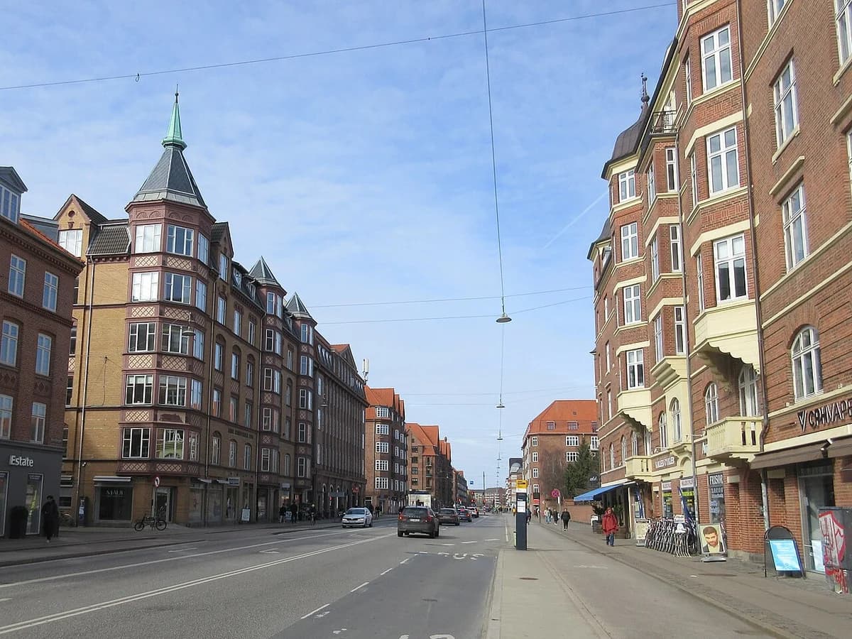 Street view of Amagerbrogade in Copenhagen with mixed old and new buildings