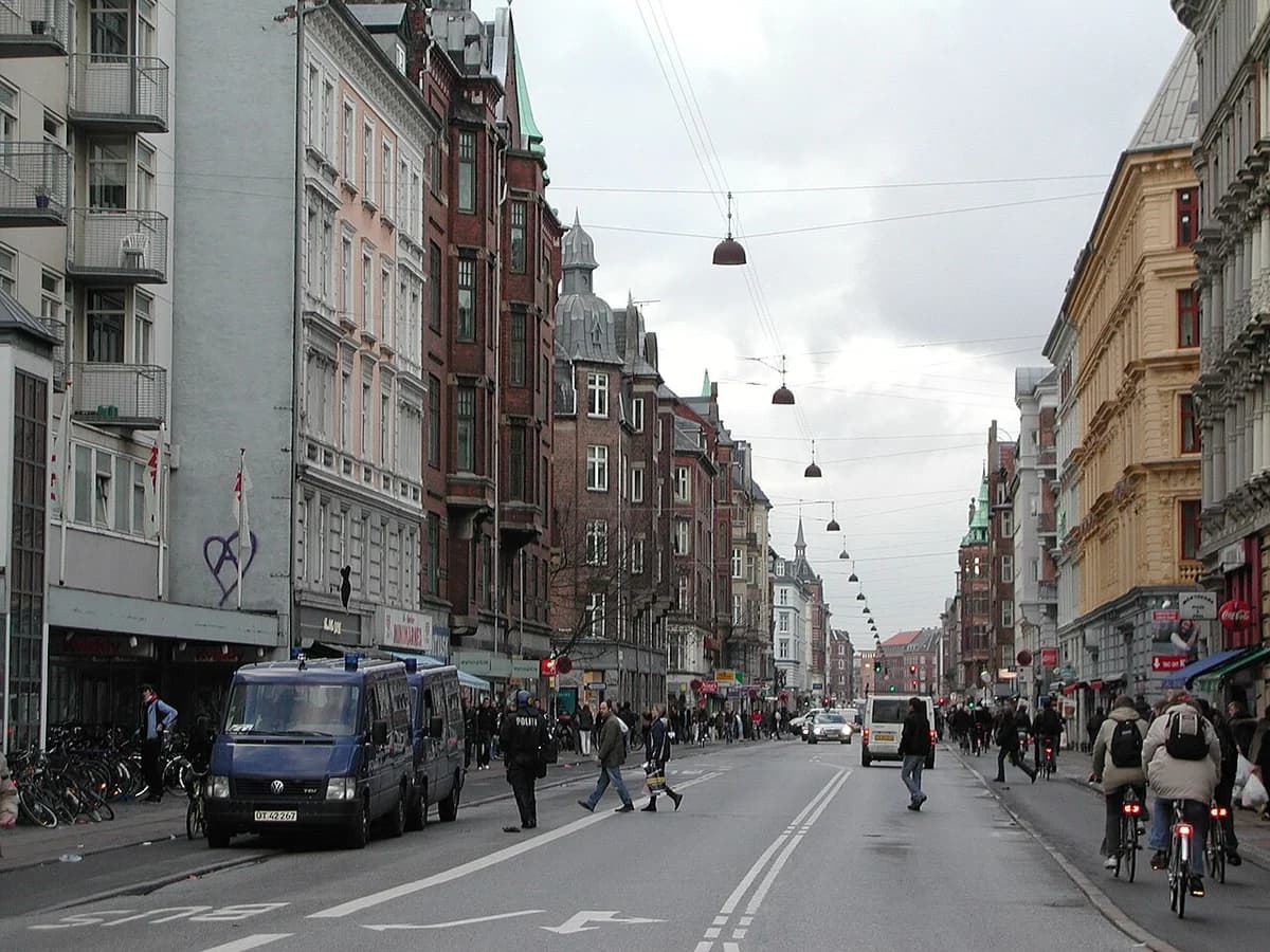 Nørrebrogade street in Copenhagen with people walking and biking