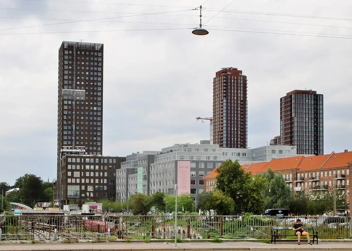 Three high-rise towers in a modern urban area of Copenhagen.