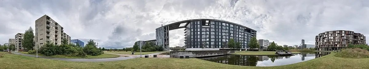 Panoramic view of modern buildings and open space in Ørestad, Copenhagen.