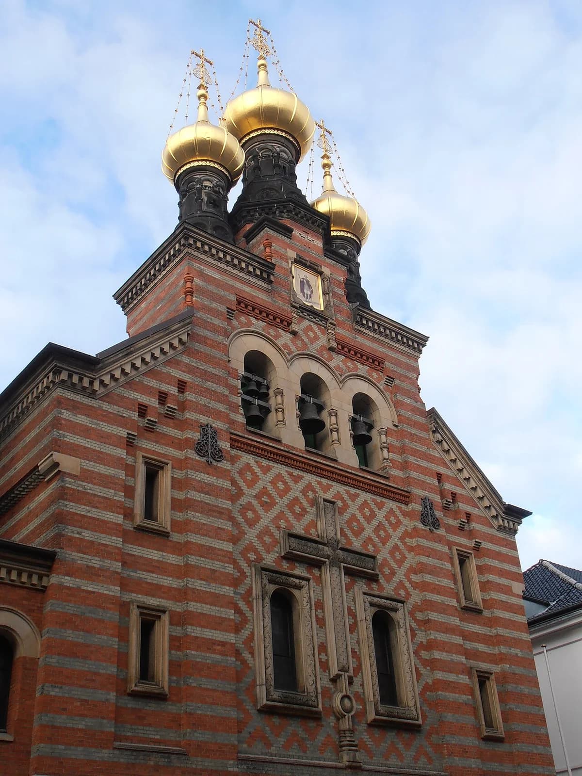 Facade of Russian Orthodox Church with golden domes in Copenhagen