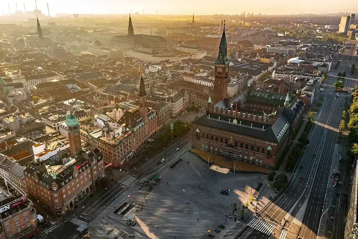 Aerial view of Copenhagen City Hall and square at sunset
