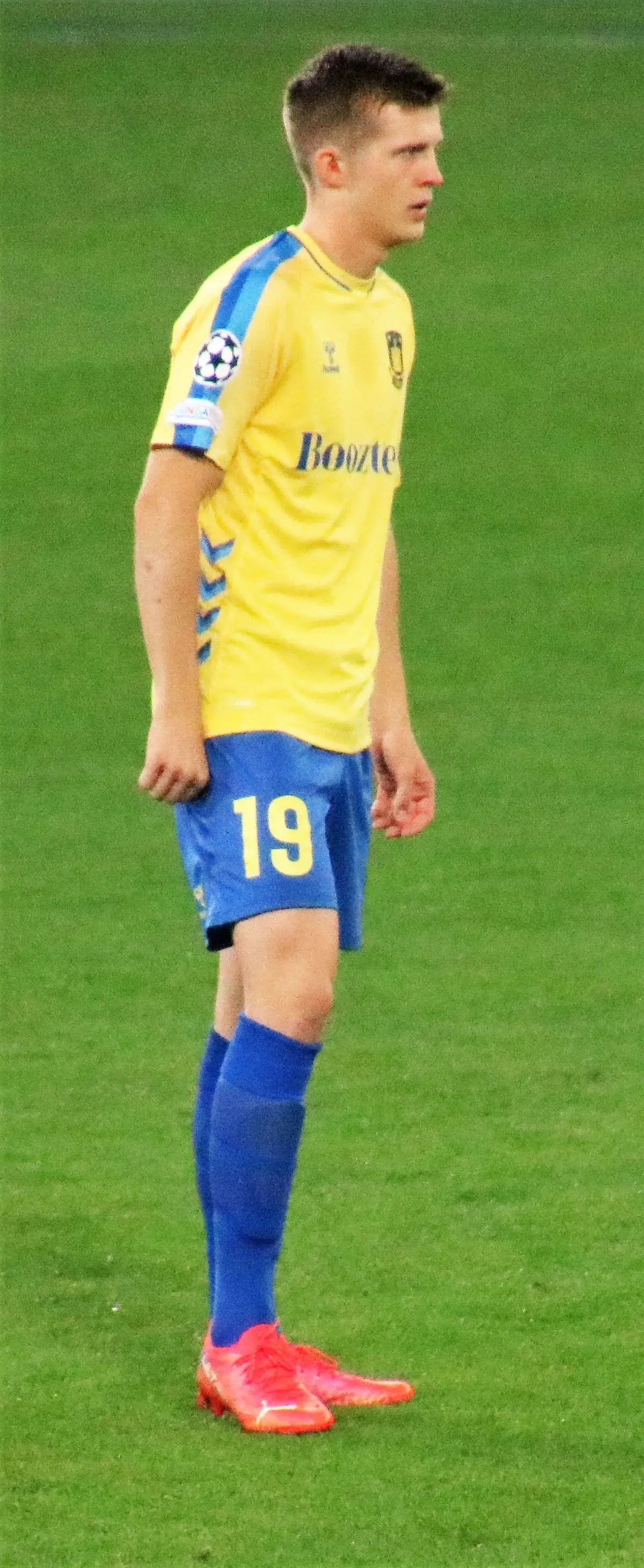 Soccer player Morten Frendrup on the field in yellow and blue kit