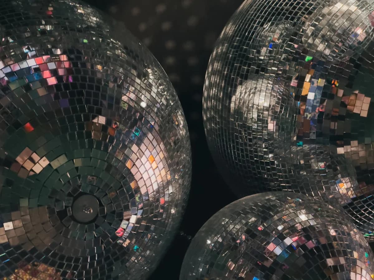 Close-up of disco balls reflecting colorful light