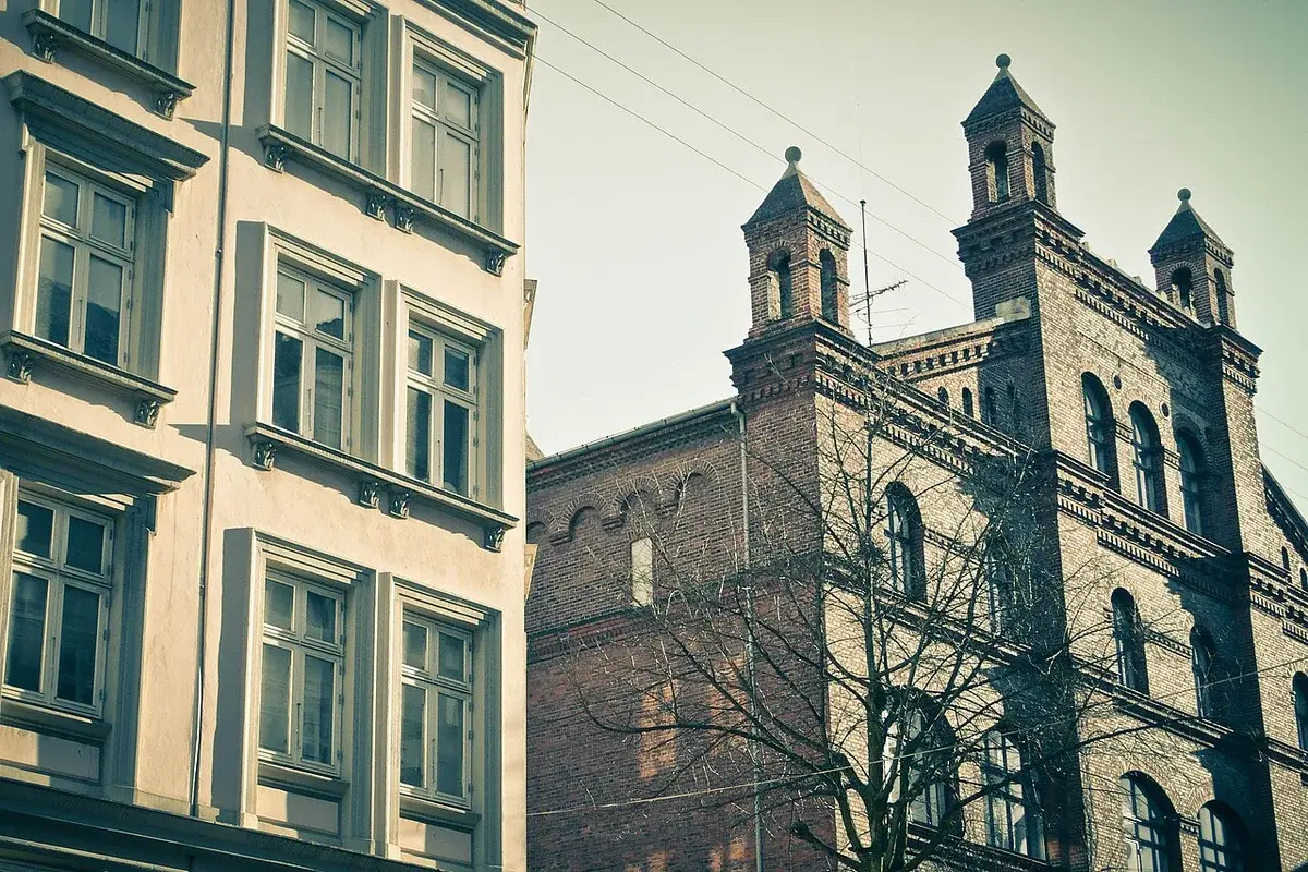 Historicist buildings in Vesterbro, Copenhagen, with decorative brick towers and arched windows.